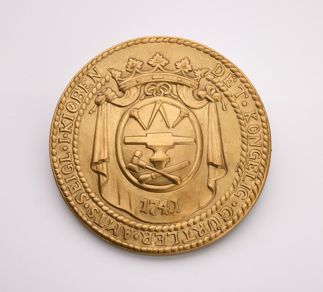 gørtlerlaugets emblem støbt af Søe-Jensen